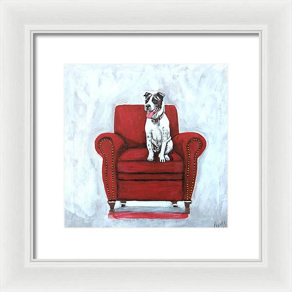 Dog on red chair - Framed Print
