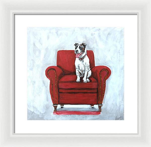 Dog on red chair - Framed Print