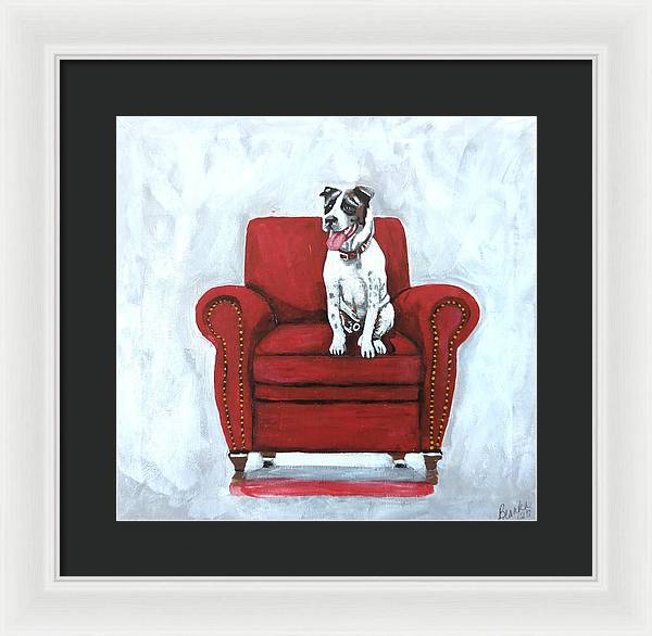 Dog on red chair - Framed Print