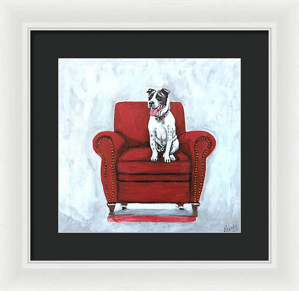 Dog on red chair - Framed Print