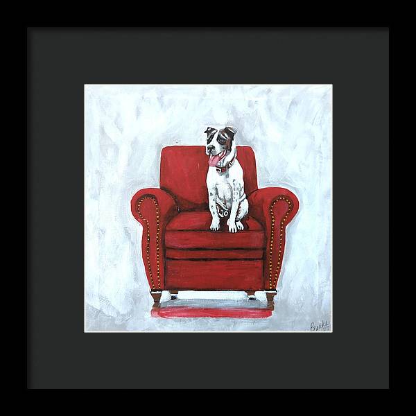 Dog on red chair - Framed Print