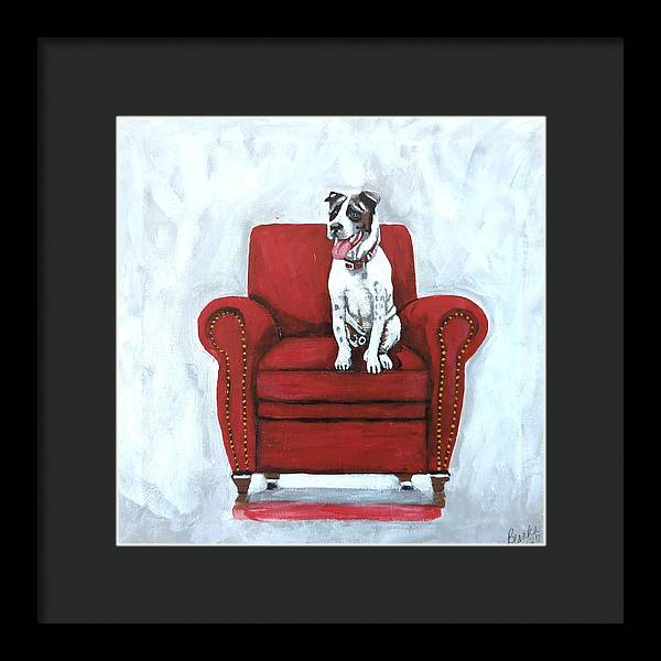 Dog on red chair - Framed Print