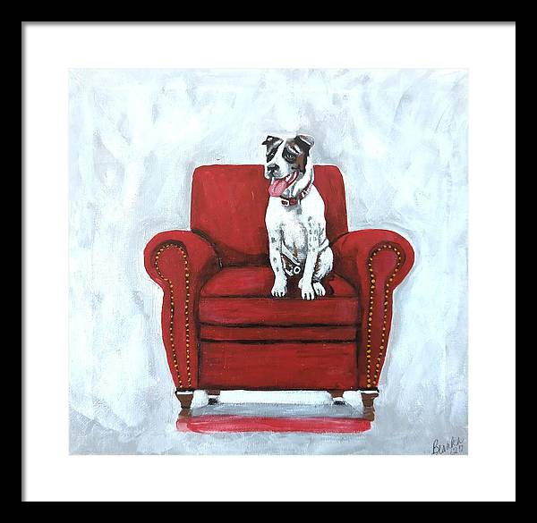 Dog on red chair - Framed Print