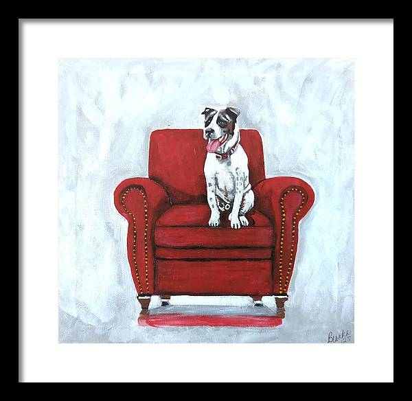 Dog on red chair - Framed Print