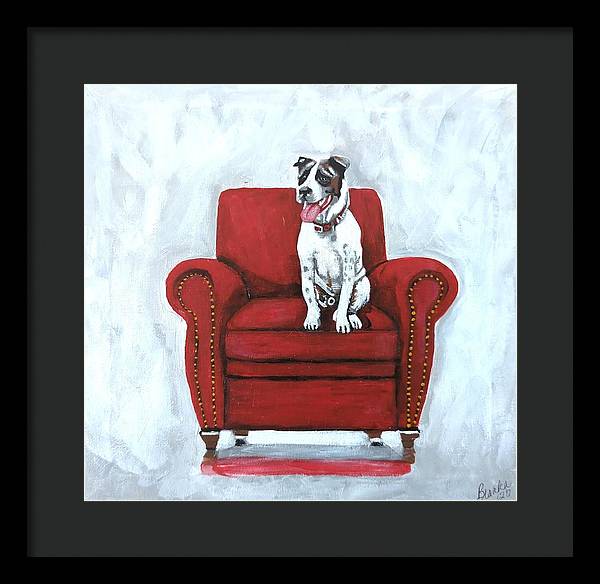 Dog on red chair - Framed Print