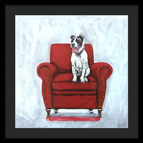 Dog on red chair - Framed Print