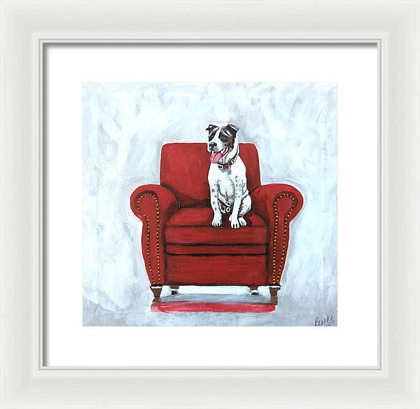 Dog on red chair - Framed Print