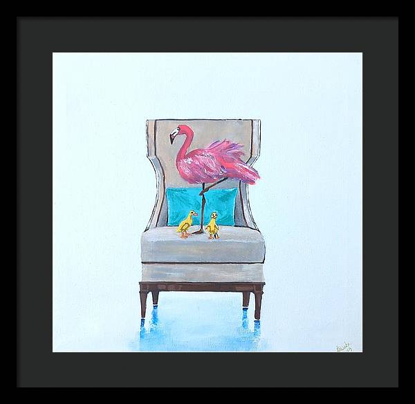 Flamingo n baby ducks on chair - Framed Print