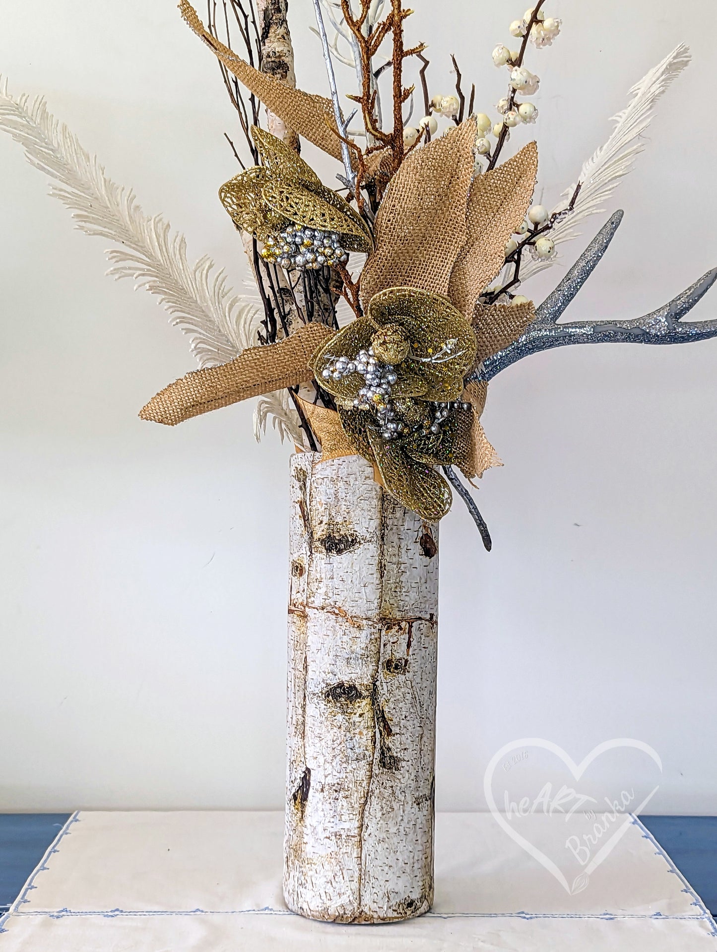 Tubular shaped glass vase created to look like a birch tree.  Note: Florals not included.