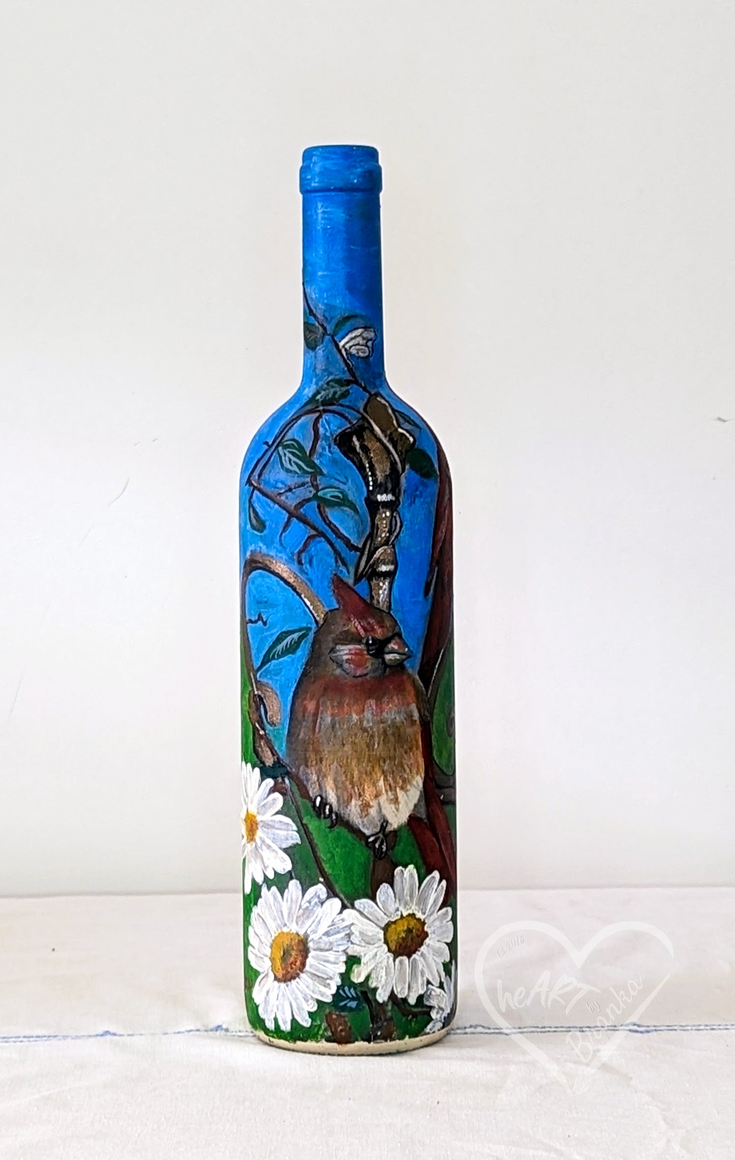 Hand painted all around the bottle.